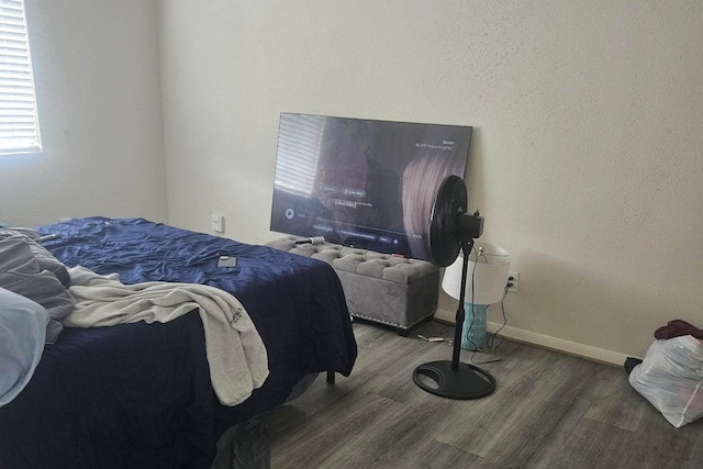 bedroom with hardwood / wood-style floors