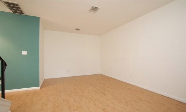 unfurnished room with light hardwood / wood-style flooring