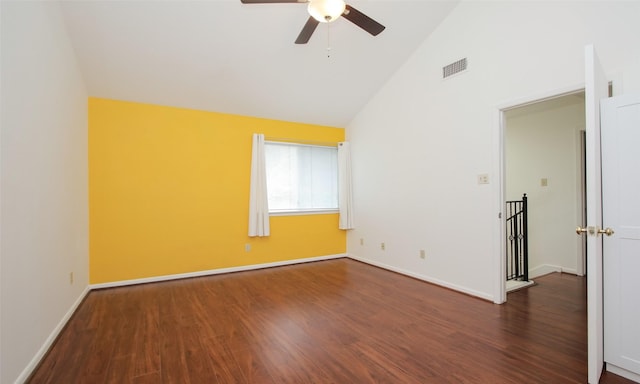 empty room featuring ceiling fan, high vaulted ceiling, and dark hardwood / wood-style floors