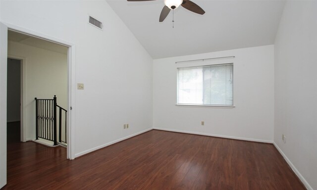 unfurnished room with vaulted ceiling, ceiling fan, and dark wood-type flooring