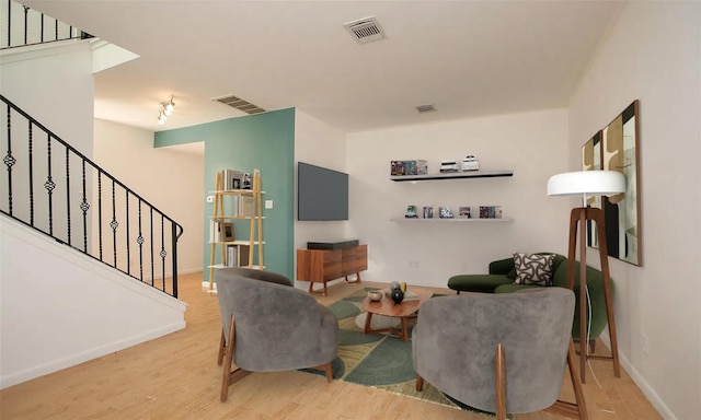 living room with light hardwood / wood-style flooring