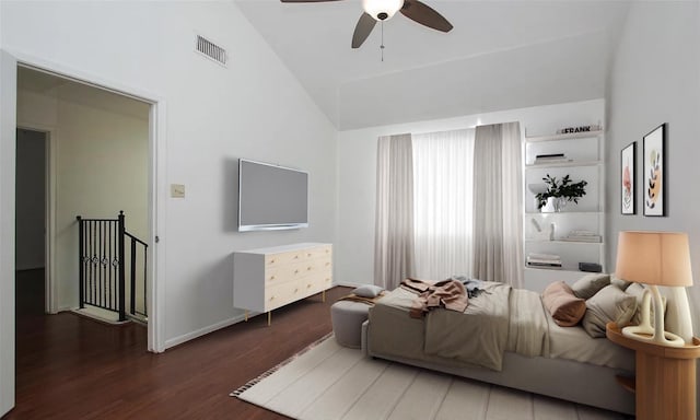 bedroom featuring ceiling fan, dark hardwood / wood-style flooring, and high vaulted ceiling