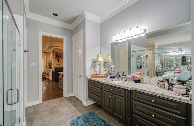 bathroom with wood-type flooring, vanity, walk in shower, and crown molding