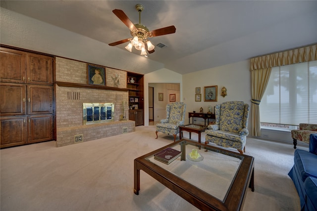 carpeted living room featuring built in shelves, ceiling fan, a fireplace, and vaulted ceiling