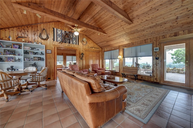 tiled living room with wood ceiling, ceiling fan, beamed ceiling, wooden walls, and high vaulted ceiling