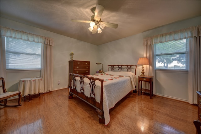 bedroom featuring light wood-type flooring and ceiling fan