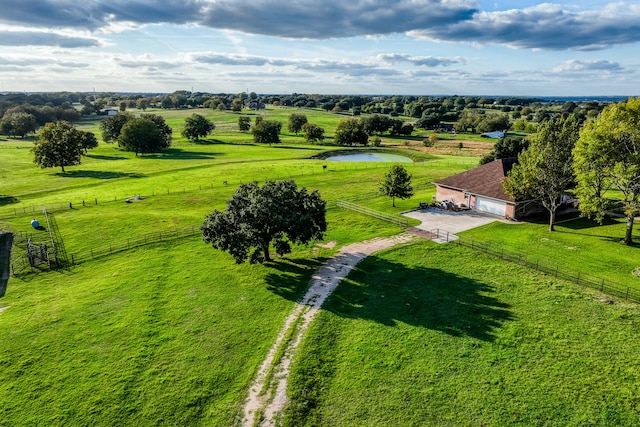 drone / aerial view featuring a rural view and a water view