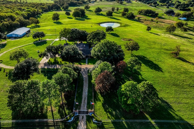 birds eye view of property with a rural view