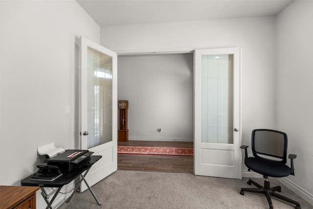 office with french doors and hardwood / wood-style floors