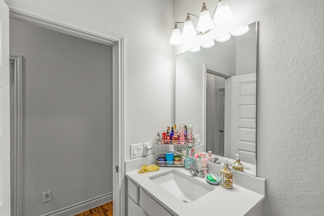 bathroom with wood-type flooring and vanity