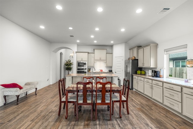 dining room featuring dark hardwood / wood-style flooring and sink