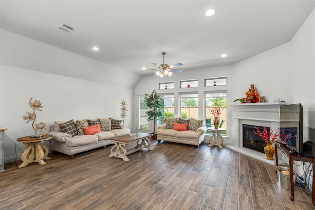 living room with ceiling fan, hardwood / wood-style flooring, and vaulted ceiling