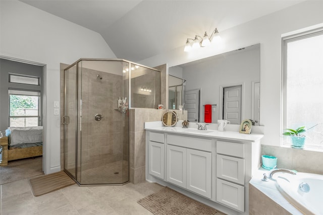 bathroom with lofted ceiling, separate shower and tub, tile patterned floors, and vanity