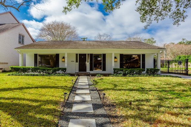 view of front of house with a porch and a front lawn