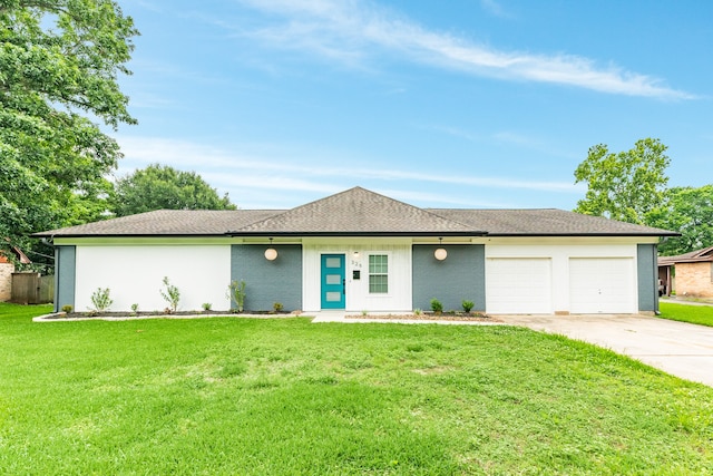 single story home featuring a garage and a front yard