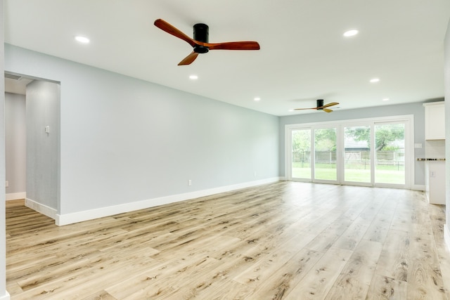 unfurnished living room featuring light wood-type flooring and ceiling fan