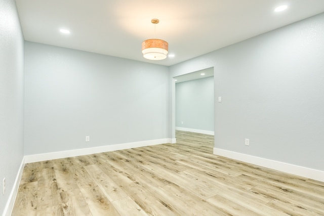 spare room with light hardwood / wood-style floors