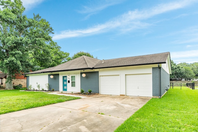 ranch-style home with a garage and a front yard