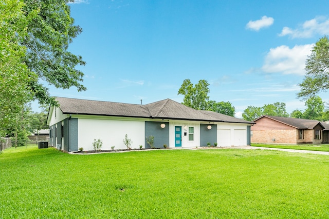 ranch-style home with a garage and a front yard