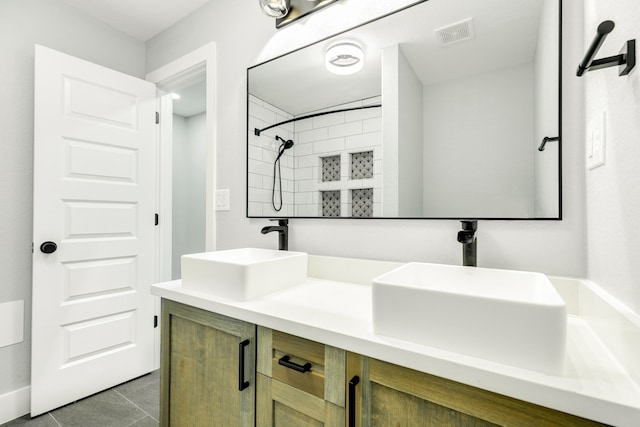 bathroom with vanity and tile patterned floors