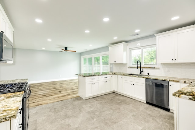 kitchen with tasteful backsplash, stainless steel appliances, light wood-type flooring, sink, and light stone counters