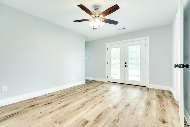 doorway featuring french doors, light wood-type flooring, and ceiling fan