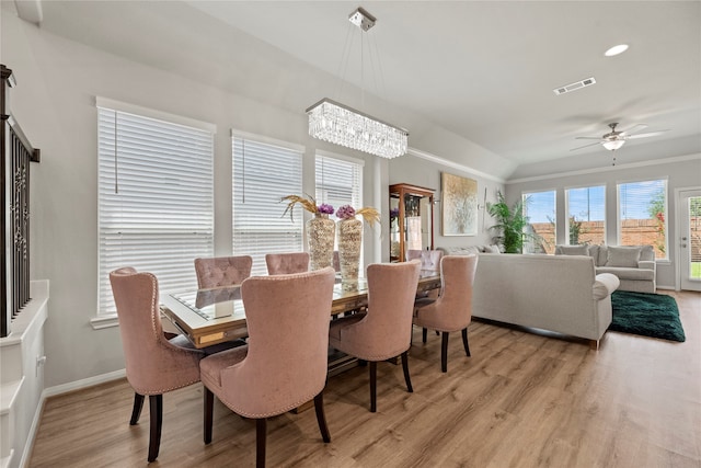 dining space with light wood-type flooring and ceiling fan