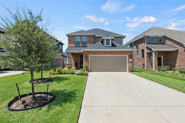 view of front of house featuring a garage and a front lawn