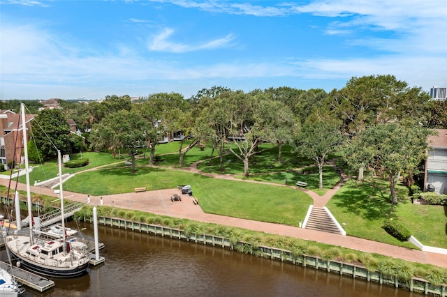 view of community featuring a water view and a boat dock