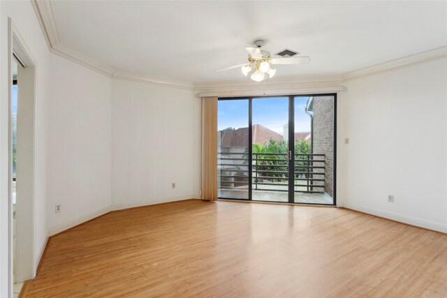 empty room with ornamental molding, ceiling fan, and light hardwood / wood-style flooring