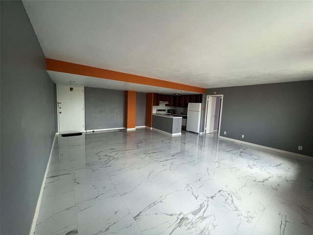 unfurnished living room featuring tile patterned flooring