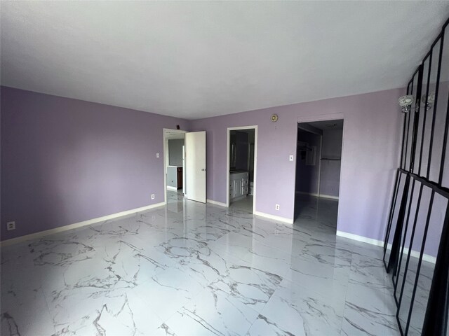 unfurnished room featuring tile patterned flooring