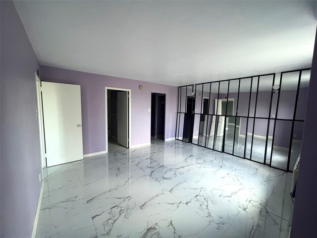 unfurnished room with tile patterned flooring