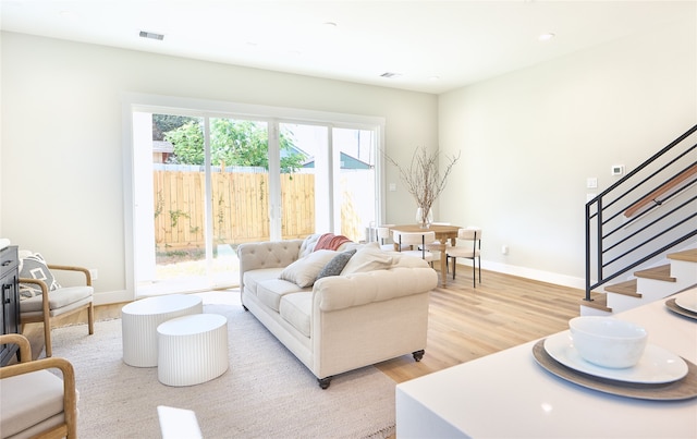 living room with light hardwood / wood-style flooring