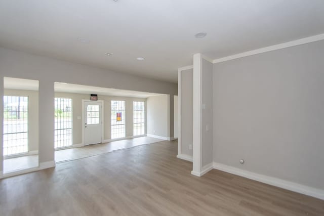 empty room with hardwood / wood-style flooring