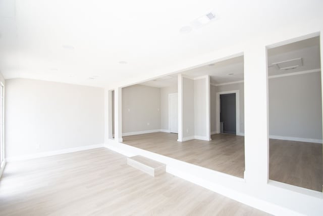 spare room with light hardwood / wood-style floors