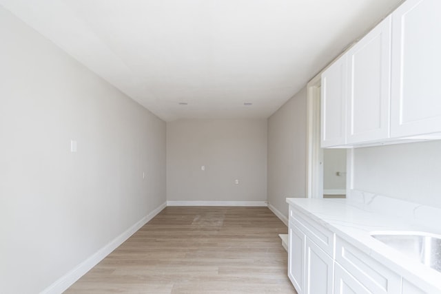 interior space with light wood-type flooring and sink