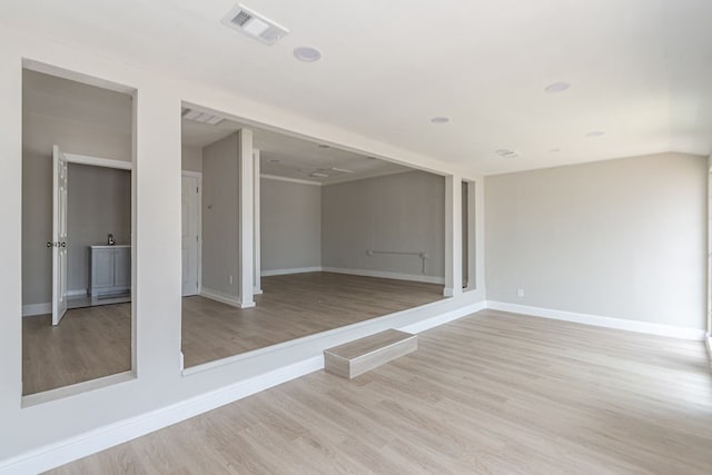 spare room with light hardwood / wood-style flooring