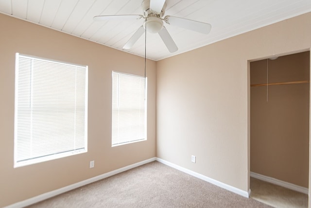 unfurnished bedroom featuring ceiling fan and carpet floors