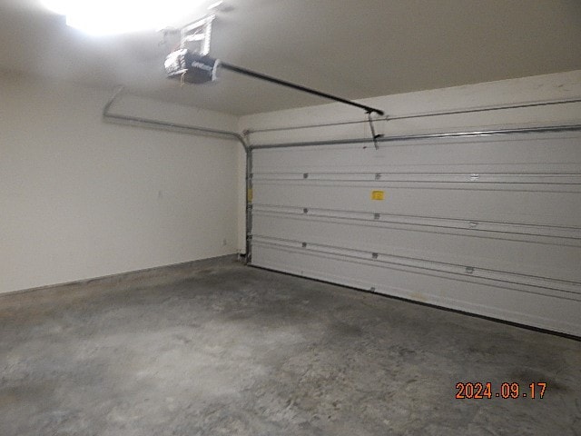 garage featuring a garage door opener