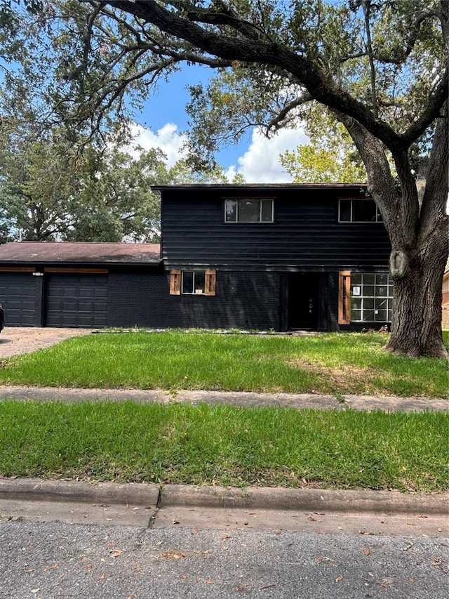 exterior space with a garage and a yard