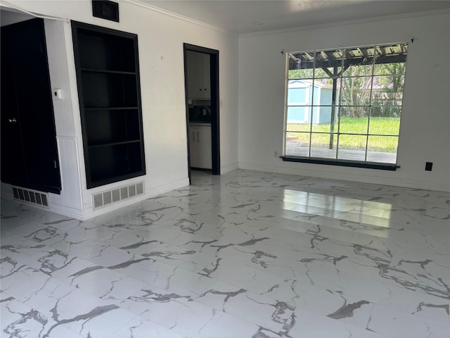 spare room with ornamental molding