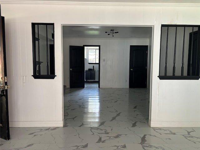 interior space with crown molding