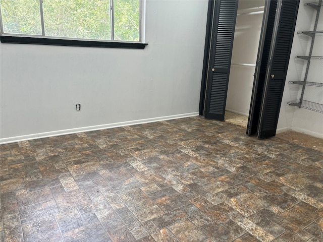 unfurnished bedroom featuring a closet