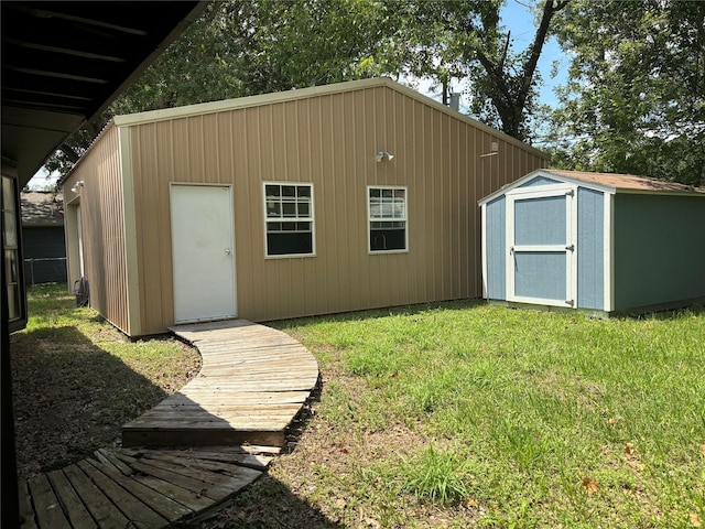 view of outbuilding with a yard