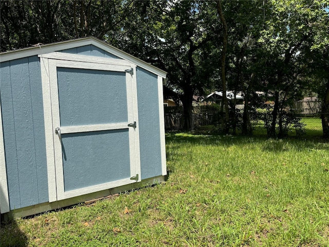 view of outdoor structure with a lawn