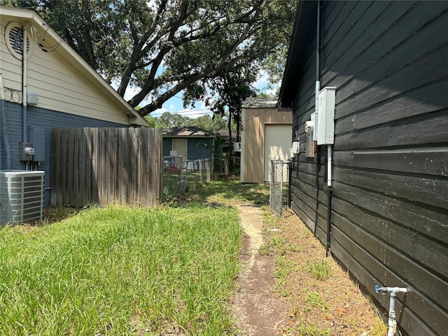 view of yard with central AC unit