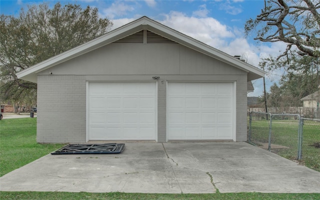 garage featuring a yard