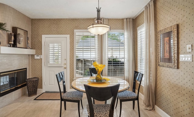 tiled dining area featuring a tile fireplace