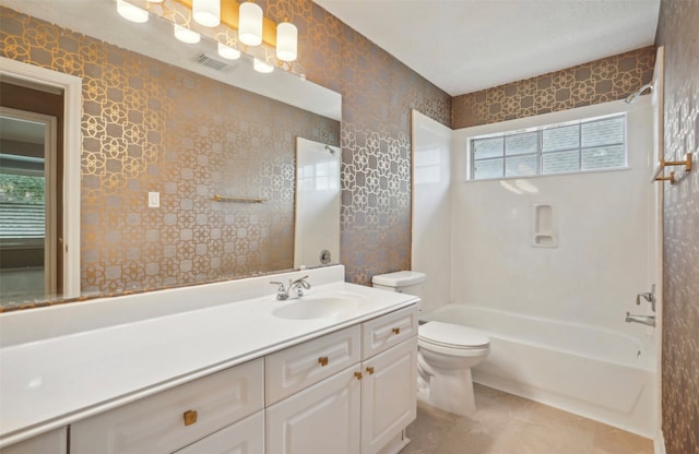 full bathroom featuring vanity, washtub / shower combination, and toilet